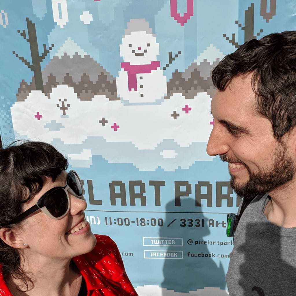 Tim and Alexandra in front of the Pixel Art Park banner